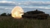 FILE - Ukrainian servicemen of the 21st Separate Mechanized Brigade fire a Leopard 2A6 tank during a military exercise, near a front line in Donetsk region, Ukraine, May 12, 2024. 