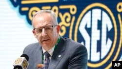 FILE - Southeastern Conference Commissioner Greg Sankey speaks in Nashville, Tenn., March 11, 2020. Conference schools will be able to bring football and basketball players back to campus for voluntary activities starting June 8, it was announced May 22.
