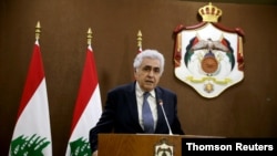 FILE PHOTO: Lebanese Foreign Minister Nassif Hitti speaks during a joint news conference with Jordanian Foreign Minister Ayman Safadi in Amman