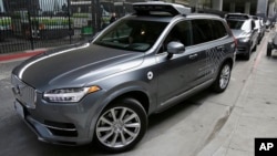 FILE - An Uber driverless car heads out for a test run in San Francisco, Dec. 13, 2016.