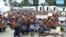 FILE - In this file photo made from Australia Broadcasting Corporation video taken shows asylum seekers protesting the possible closure of their detention center on Manus Island, Papua New Guinea, Oct. 31, 2017.
