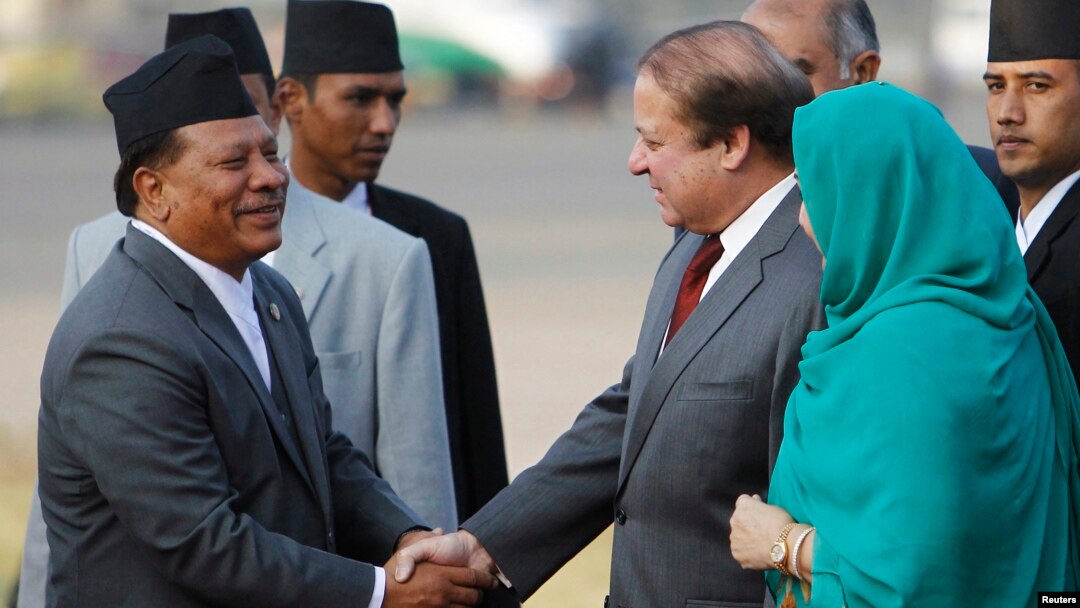 FILE - Nepali Deputy Prime Minister Prakash Man Singh (L) shakes hands with Pakistani Prime Minister Nawaz Sharif upon his arrival for the 18th South Asian Association for Regional Cooperation (SAARC) summit in Kathmandu, Nov. 25, 2014.