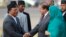 FILE - Nepali Deputy Prime Minister Prakash Man Singh (L) shakes hands with Pakistani Prime Minister Nawaz Sharif upon his arrival for the 18th South Asian Association for Regional Cooperation (SAARC) summit in Kathmandu, Nov. 25, 2014.