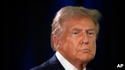 Republican presidential nominee former President Donald Trump speaks to reporters in the spin room after a presidential debate with Democratic presidential nominee Vice President Kamala Harris, Sept. 10, 2024, in Philadelphia.