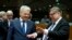 FILE - Belgian Foreign Minister Didier Reynders, left, speaks with Finnish Foreign Minister Timo Juhani Soini during a meeting of EU foreign ministers at the EU Council building in Brussels on Monday, Nov. 14