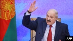 Belarus' President Alexander Lukashenko gestures during a press conference in Minsk, Jan. 29, 2015. 