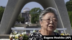 Koko Kondo speaks during an interview with The Associated Press in front of the cenotaph for the atomic bombing victims near Hiroshima Peace Memorial Museum in Hiroshima, western Japan Wednesday, Aug. 5, 2020.(AP Photo/Eugene Hoshiko)