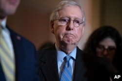 Senate Majority Leader Mitch McConnell, R-Ky., speaks to reporters on Capitol Hill in Washington, Feb. 25, 2020.
