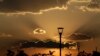 Palm trees in City Park are silhouetted at dusk in Brasilia, Brazil, Oct. 6, 2020.