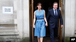 Britain's Prime Minister David Cameron and his wife Samantha leave after voting in the EU referendum in London, Thursday, June 23, 2016.