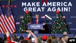 FILE - Former US President Donald Trump speaks at a rally in Waterloo, Iowa, on December 19, 2023. An appeals court in Colorado on December 19 ruled he cannot appear on the state's presidential primary ballot because of his role in the attack on the Capitol in January 2021.