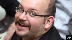 FILE - Jason Rezaian, an Iranian-American correspondent for the Washington Post, is shown in a 2013 photo.