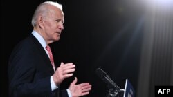 (FILES) In this file photo taken on March 12, 2020 former US Vice President and Democratic presidential hopeful Joe Biden speaks about COVID-19, known as the Coronavirus, during a press event in Wilmington, Delaware. - Former Vice President Joe…
