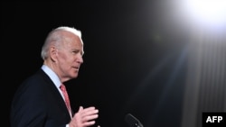 In this file photo taken on March 12, 2020 former US Vice President and Democratic presidential hopeful Joe Biden speaks about COVID-19 during a press event in Wilmington, Delaware.