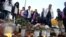 People light candles outside Kronan school in Trollhattan, Sweden following a knife attack on Thursday, October 23, 2015.