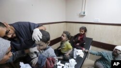 FILE - Palestinian children wounded in the Israeli bombardment of the Gaza Strip are treated at al Aqsa Hospital on Deir al Balah, Gaza Strip, November 21, 2023.