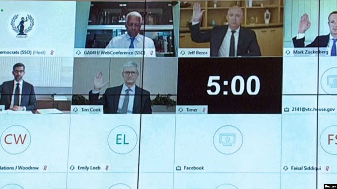 Amazon CEO Jeff Bezos, Facebook CEO Mark Zuckerberg, Google CEO Sundar Pichai and Apple CEO Tim Cook all raise their hands to be sworn in to testify remotely via videoconference during a U.S. House Judiciary Subcommittee on Antitrust, Commercial and Administrative Law hearing on 