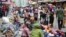 Pedestrians shop at a busy Balogun Market in Lagos, Nigeria, Sept. 5, 2017. Nigeria announced it will start issuing visas on arrival to all Africans as a way to improve intra-African trade.