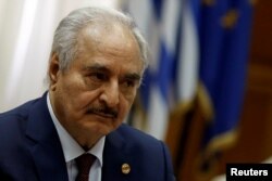 Libyan commander Khalifa Haftar meets Greek Prime Minister Kyriakos Mitsotakis (not pictured) at the Parliament in Athens, Greece, Jan. 17, 2020.