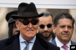 FILE - Roger Stone arrives for his sentencing at federal court in Washington, Feb. 20, 2020.