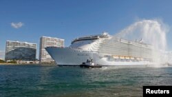 FILE - A Royal Caribbean cruise ship enters port in Fort Lauderdale as seen from nearby Hollywood, Florida, Nov. 11, 2010. 