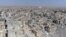 FILE - This frame grab made from drone video shows damaged buildings in Raqqa, Syria, Oct. 19, 2017.