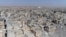 This Oct. 19, 2017, frame grab made from drone video shows damaged buildings in Raqqa, Syria.
