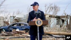 President Joe Biden speaks after surveying storm damage from tornadoes and extreme weather in Dawson Springs, Ky., Dec. 15, 2021.