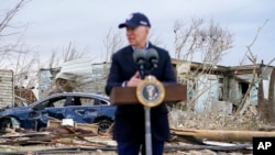 President Joe Biden speaks after surveying storm damage from tornadoes and extreme weather in Dawson Springs, Ky., Dec. 15, 2021.