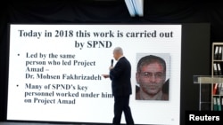 Israeli Prime Minister Benjamin Netanyahu points at a screen with an image of Iranian nuclear scientist Mohsen Fakhrizadeh during a news conference at the Ministry of Defence in Tel Aviv, April 30, 2018.