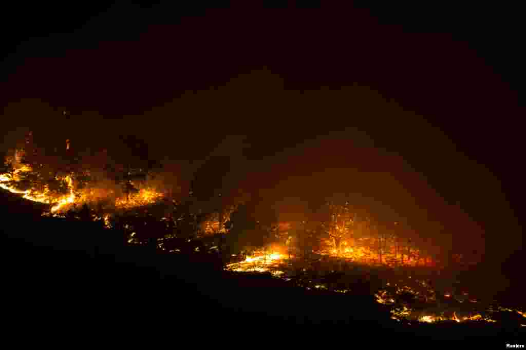 A forest fire burns out of control in Las Manchas, on the southwestern part of La Palma island, Spain.