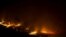 FILE - A forest fire burns out of control in Las Manchas, on the southwestern part of La Palma island, Spain, early August 5, 2016.