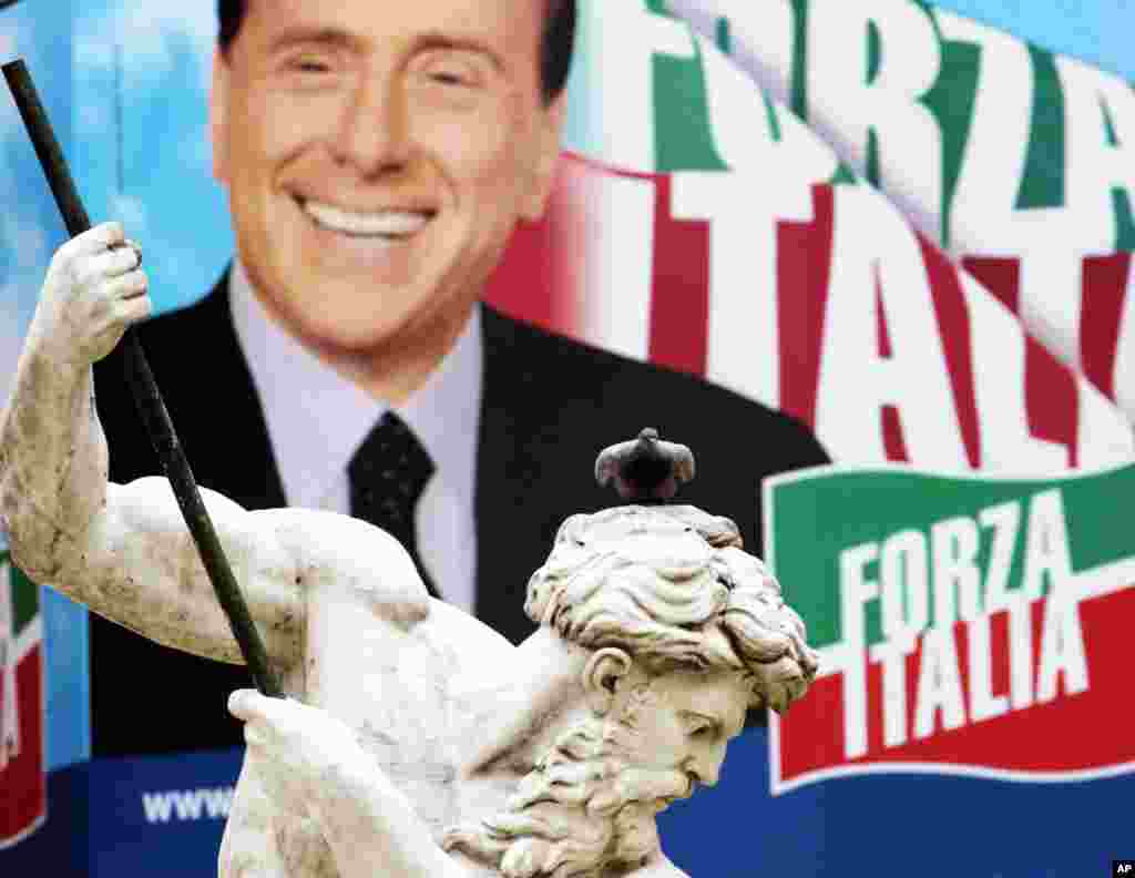 He is re-elected prime minister in 2001 and served until 2006, when he lost again to Prodi. But the five-year term made him the longest serving prime minister in post-WWII Italy. (AP Photo/Gregorio Borgia)