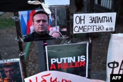 FILE — People mourn at a makeshift memorial for late Russian opposition leader Alexei Navalny in Yerevan, Armenia, to honor his memory on March 1, 2024.