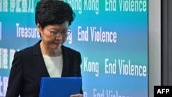 Hong Kong Chief Executive Carrie Lam leaves after a press conference in Hong Kong, Oct. 4, 2019.