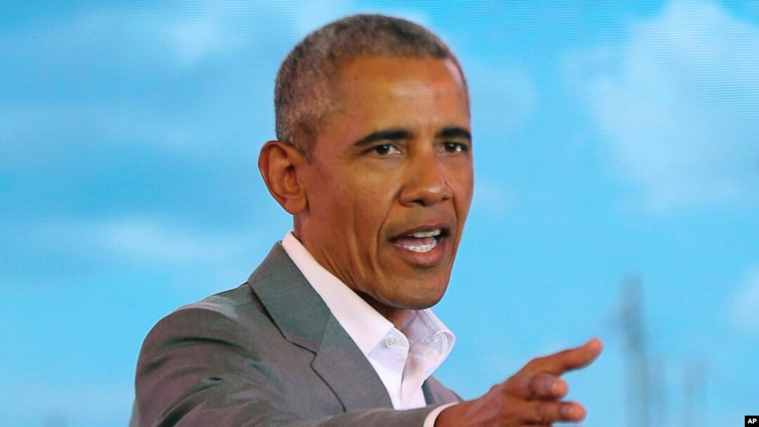 Former US President Barack Obama gestures to the crowd, during an event in Kogelo, Kisumu, Kenya, July 16, 2018.