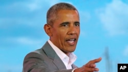 Former US President Barack Obama gestures to the crowd, during an event in Kogelo, Kisumu, Kenya, July 16, 2018.