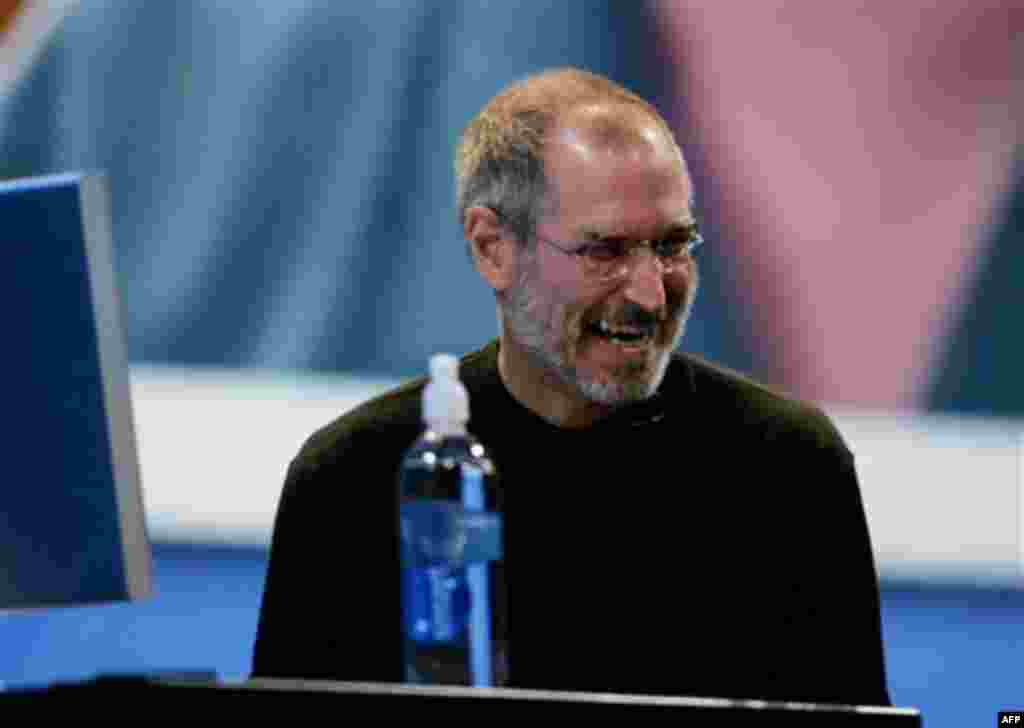 Apple Computer CEO Steve Jobs laughs at his keynote at Apple Worldwide Developer Conference in San Francisco, Monday, Aug. 7, 2006. Jobs talked about "Leopard," the next major update to the Mac OS. (AP Photo/Paul Sakuma)