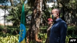 FILE - Prime Minister of Ethiopia Abiy Ahmed stands during an event honoring the national defense forces, in Addis Ababa, Nov. 17, 2020. 