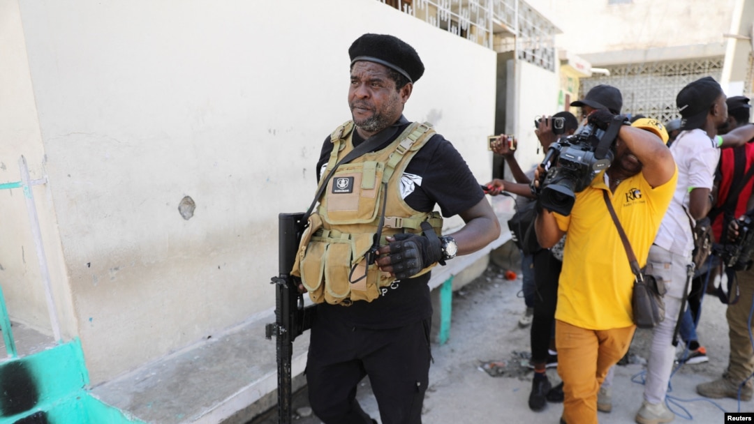 FILE - Gang leader Jimmy "Barbecue" Cherizier talks to reporters in Port-au-Prince, Haiti, March 11, 2024. Armed men working under Cherizier ambushed a police patrol vehicle in the Delmas 18 neighborhood June 9, 2024, and set it on fire, police said. Three officers died.