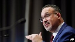 FILE - In this Feb. 3, 2021, file photo, Education Secretary nominee Miguel Cardona testifies before the Senate Health, Education, Labor and Pensions committee during his confirmation hearing on Capitol Hill in Washington. 