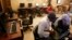 FILE - People sit in an internet cafe in Cairo, Feb. 3, 2008. 