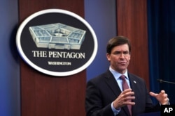 FILE - Defense Secretary Mark Esper speaks during a news conference at the Pentagon in Washington, Dec. 20, 2019.
