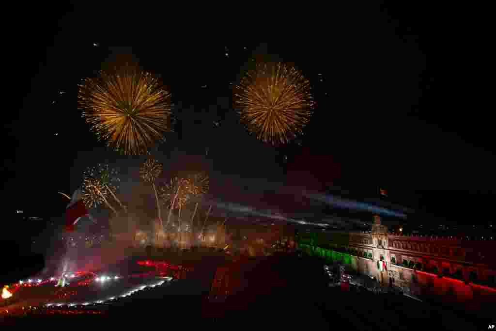 A fireworks display is seen in front of the Metropolitan Cathedral after Mexican President Andres Manuel Lopez Obrador gave the annual independence shout to kick off Independence Day celebrations, at the Zocalo in Mexico City, Sept. 15, 2020.