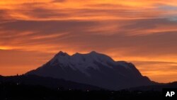 Illimani Mountain is capped with snow at dawn near La Paz, Bolivia, Oct. 23, 2013. 