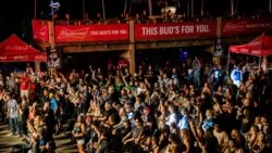 FILE - Fans attend a performance by Saul at the Iron Horse Saloon during the 80th annual Sturgis Motorcycle Rally, in Sturgis, S.D., Aug. 14, 2020. A number of people who attended the rally have come down with COVID-19.