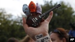 Supporter of the punk band Pussy Riot with a sign on her wrist reading "They are your children, Russia," Moscow, Aug. 17, 2012.