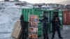 Workers prepare election campaign banners outside the polling station during general election in Nuuk, Greenland, March 11, 2025.