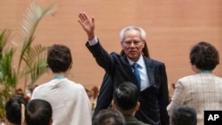 The sole candidate for the Macao chief executive post, Sam Hou Fai, the city's former top judge, celebrates after declaring his victory in the chief executive election in Macao, Oct. 13, 2024.