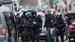 French police forces take position in the Neudorf district of Strasbourg, eastern France, Thursday, Dec. 13, 2018. 